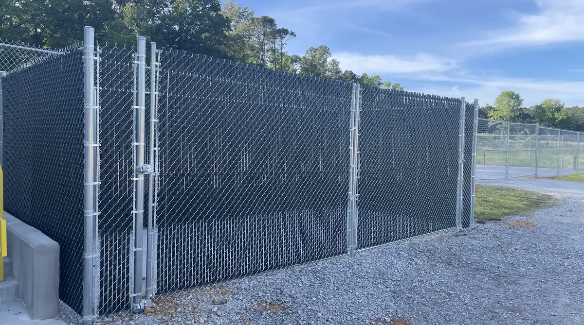 Chain link fence installation in Orangeburg SC by Dubya LLC - commercial chain link with privacy slats